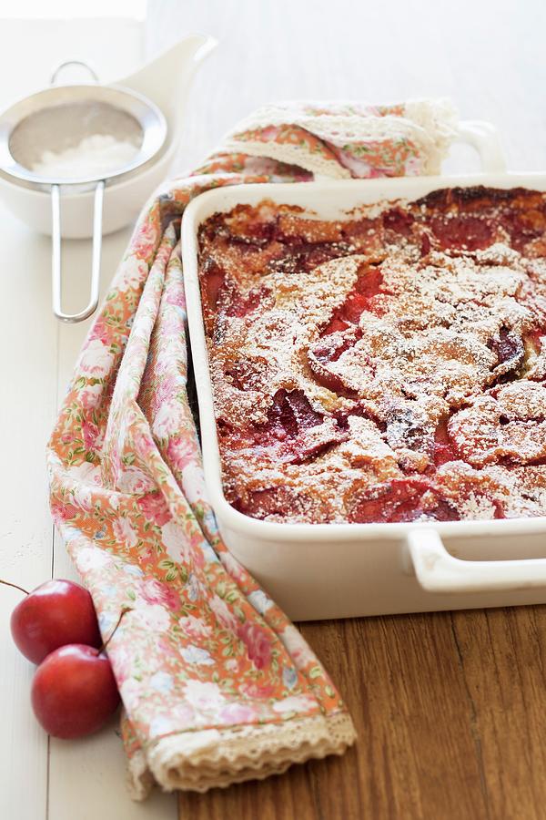 Freshly Baked Clafoutis With Plums In A Baking Dish Photograph by Joana Leito