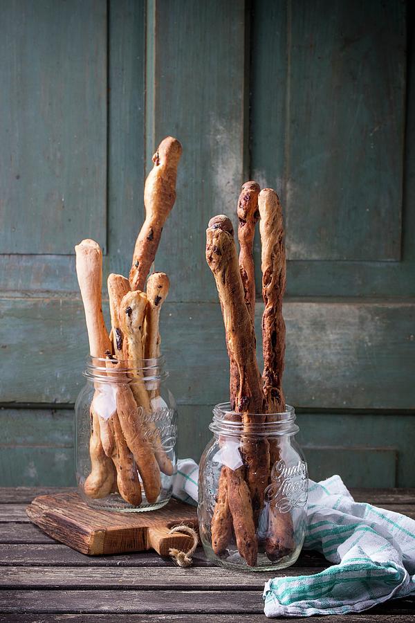 Freshly Baked Homemade Bread Sticks In Glasses On A Wooden Table Photograph by Natasha Breen