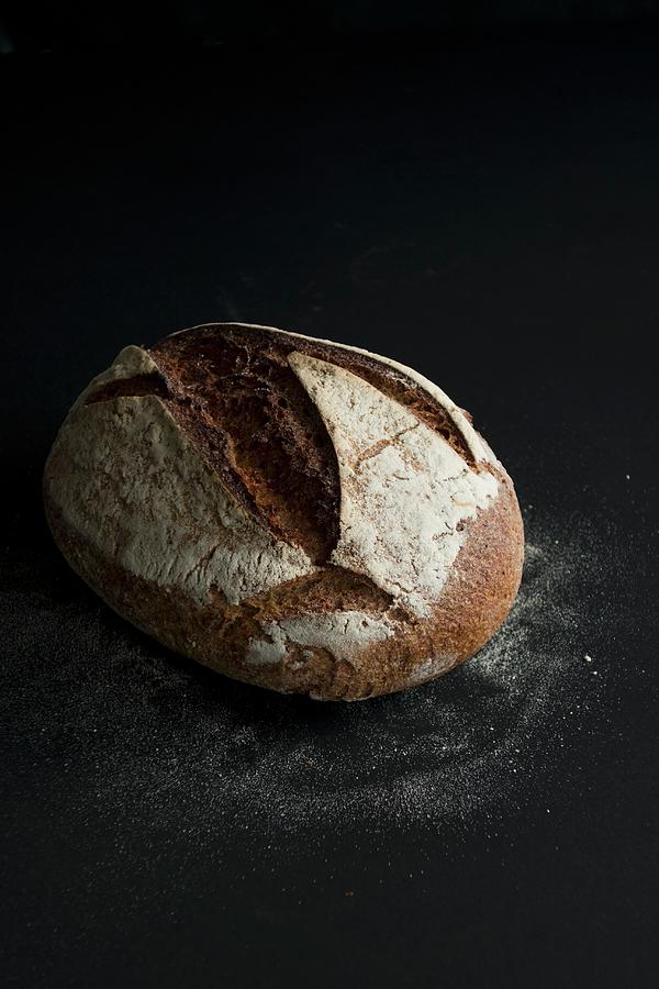 Freshly Baked Loaf Of Sourdough Bread Photograph by Eva Lambooij