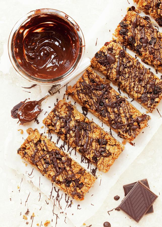 Freshly Baked Muesli Bars With Chocolate And Brown Sugar Photograph by Jane Saunders