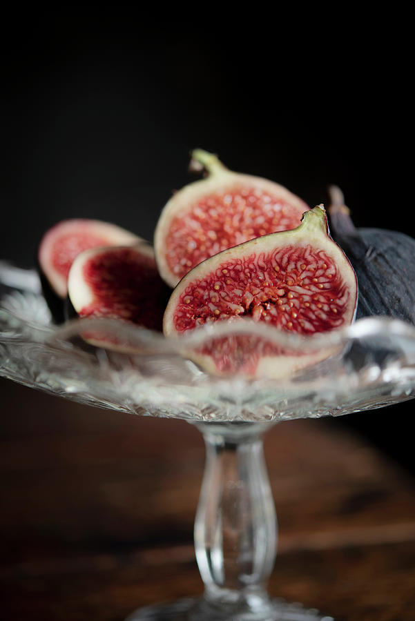 Freshly Cut Figs In A Glass Bowl Photograph by Justina Ramanauskiene