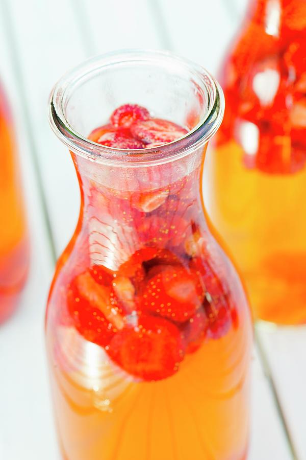 Freshly Made Strawberry Vinegar In A Bottle Photograph by Esther Hildebrandt
