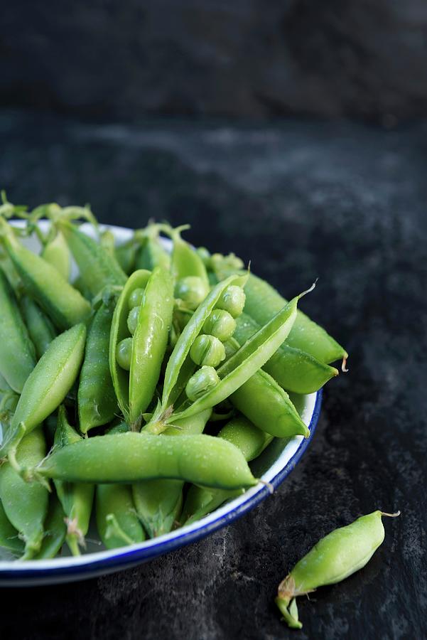 Freshly Washed Pea Pods In An Enamel Bowl Photograph by Komar