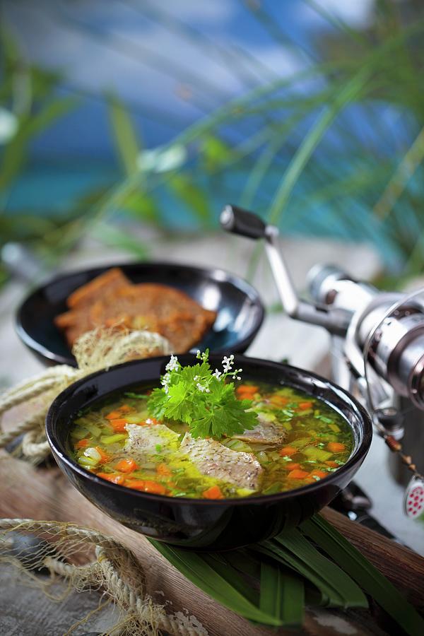 Freshwater Fish Soup With Fresh Herbs Photograph by Boguslaw Bialy