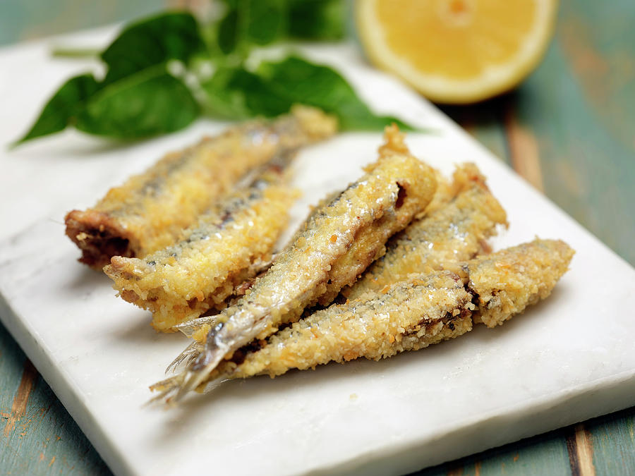 Fried Anchovies With Lemon Photograph by Michele Cozzolino