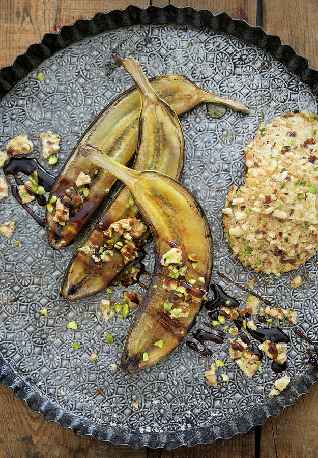 Fried Bananas With Syrup And Oat Biscuits Photograph by Martina Schindler