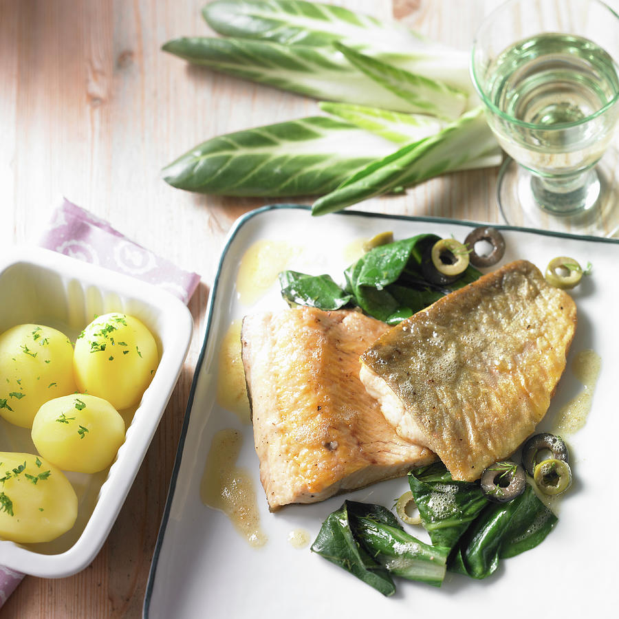 Fried Char With Lemon Butter On A Bed Of Chard And Green Olives Photograph by Brigitte Wegner