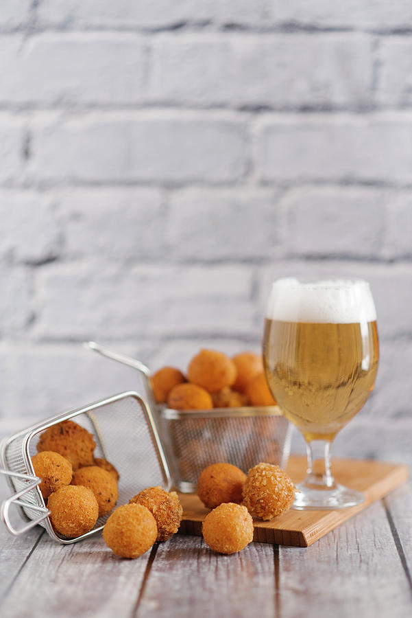 Fried Cheese Balls And A Glass Of Light Beer Photograph by Kuzmin5d