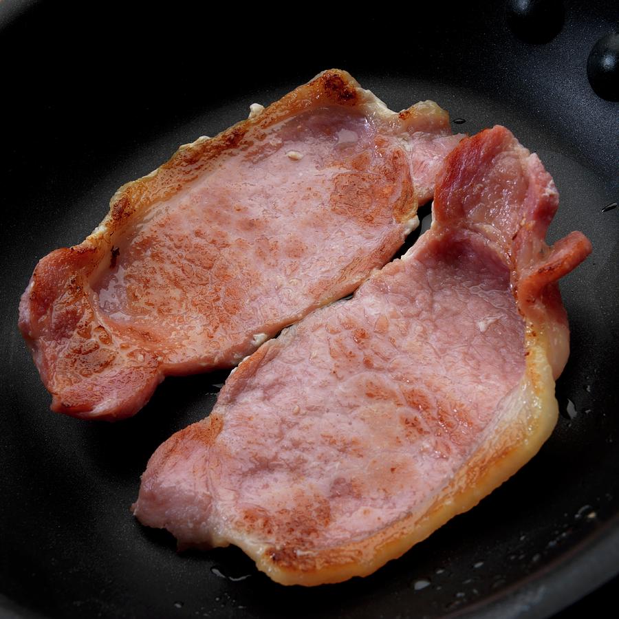 Fried English Style Bacon In Skillet Photograph by Paul Poplis