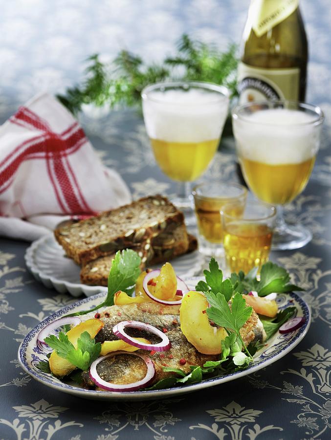 Fried Herring With Apples And Onions Served With Aquavit And Beer ...