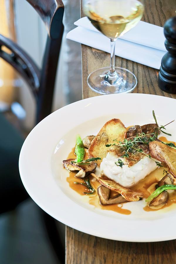 Fried Iceland Cod With Mushrooms, Potatoes And Veal Jus Photograph by Jalag / Markus Bassler