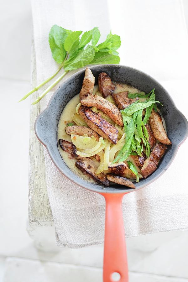 Fried Liver With Onions And Mint In A Frying Pan Photograph by Tanja Major
