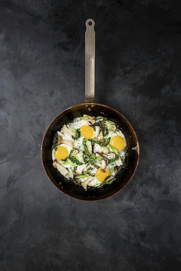 Fried Mushrooms With Fried Eggs And Strips Of Savoy Cabbage Photograph by Sarah Coghill