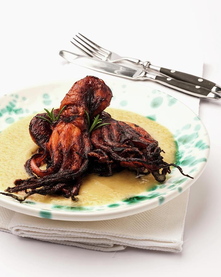 Fried Octopus On A Bed Of Creamy Polenta Photograph by Paolo Della ...