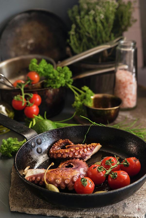 Fried Octopus With Tomatoes And Capers In A Pan Photograph by Galya Ivanova