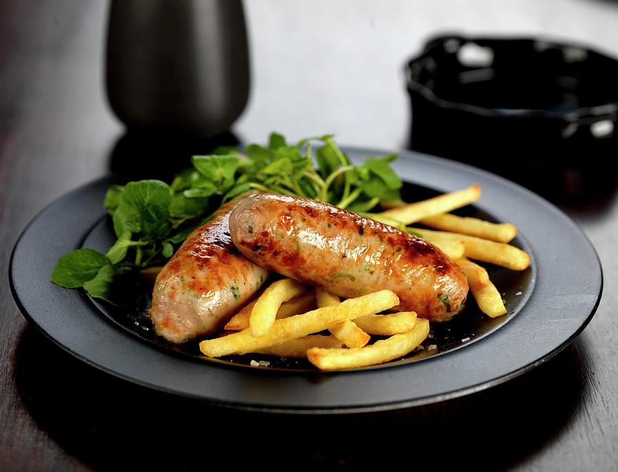 Fried Pork And Ale Sausages With French Fries And Watercress Photograph by Robert Morris