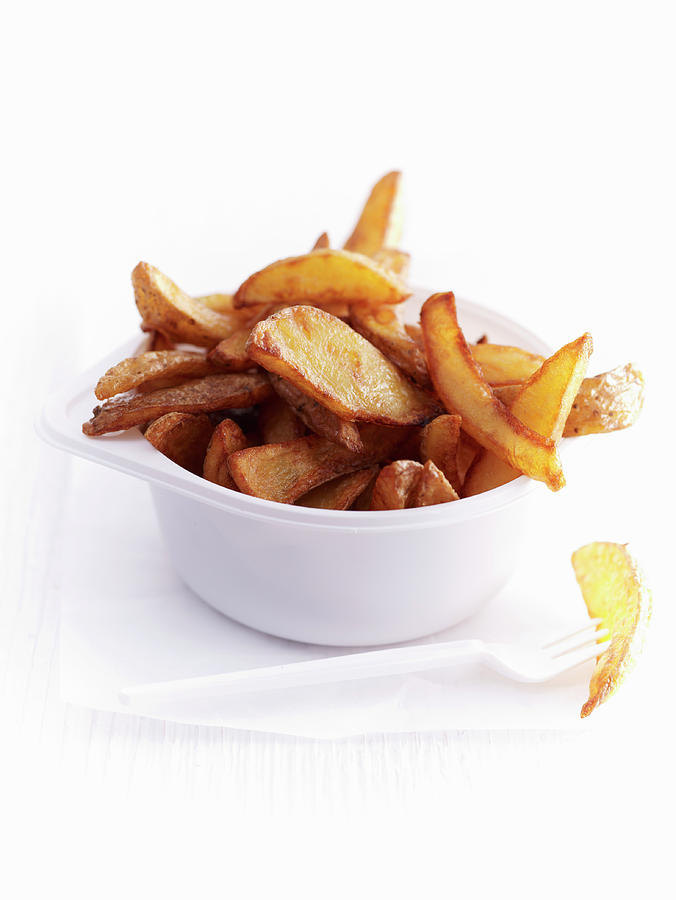 Fried Potato Wedges Photograph by Oliver Brachat