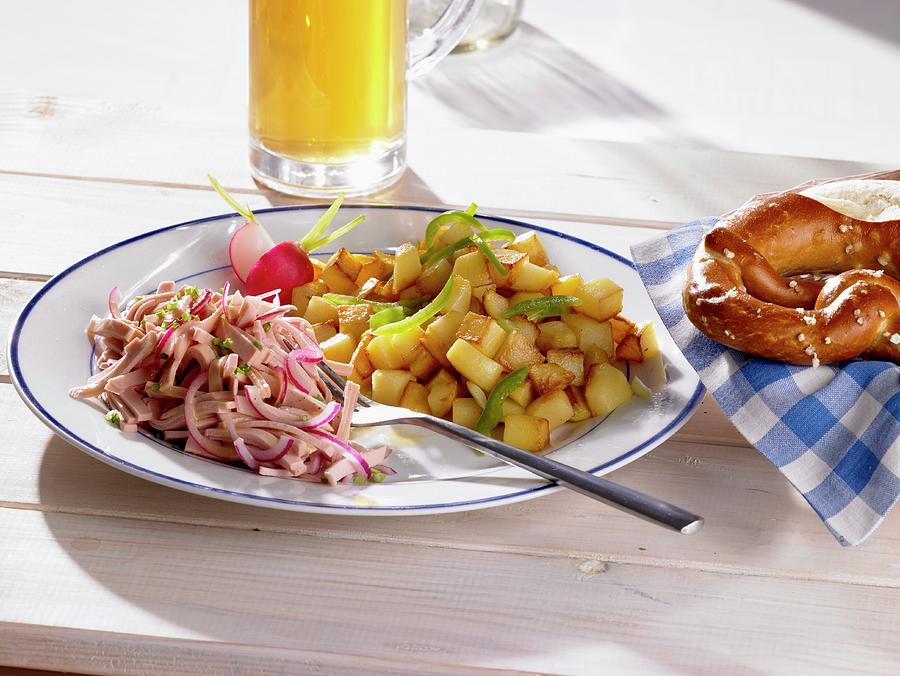Fried Potatoes With A Sausage Salad, Petzels And Beer bavaria, Germany Photograph by Barbara Lutterbeck