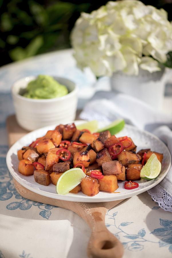 Fried Potatoes With Chillies And Limes Photograph by Winfried Heinze