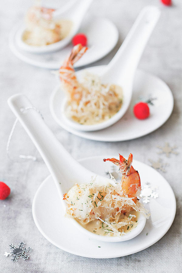 Fried Prawns In Sauce On Porcelain Spoons Photograph by Marie Sjoberg