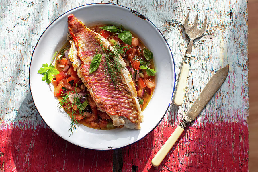 Fried Red Mullet Fillet On A Tomato And Onion Salad With Fresh Herbs Photograph by Lara Jane Thorpe