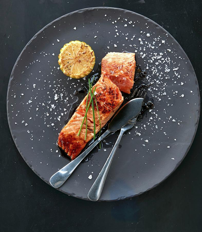 Fried Salmon With Lemon Photograph by Robbert Koene