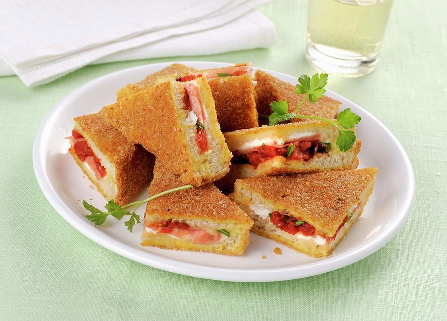 Fried Sandwiches Filled With Roasted Tomatoes Photograph by Franco Pizzochero