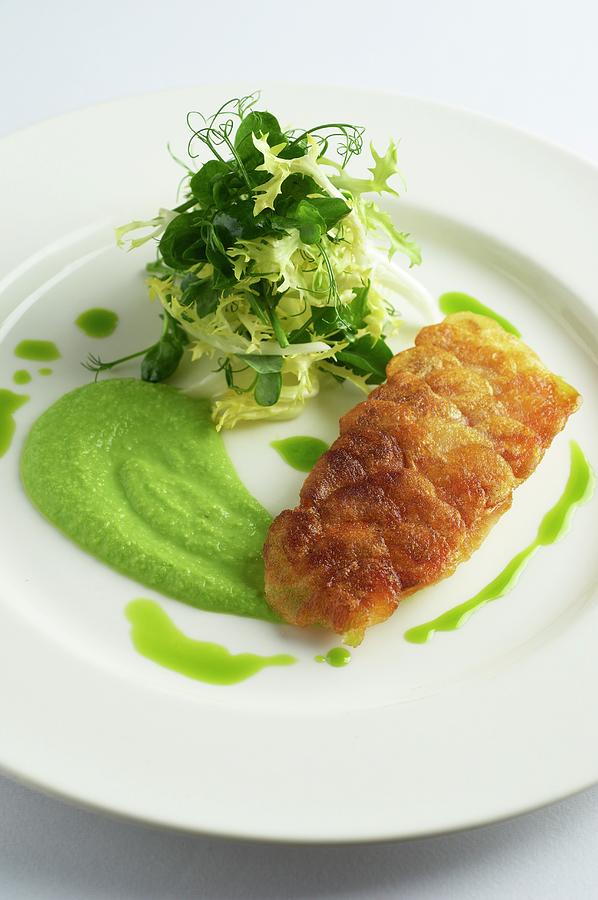 Fried Sea Bass Fillet With Pea Pure And A Side Salad Photograph by Tim Green