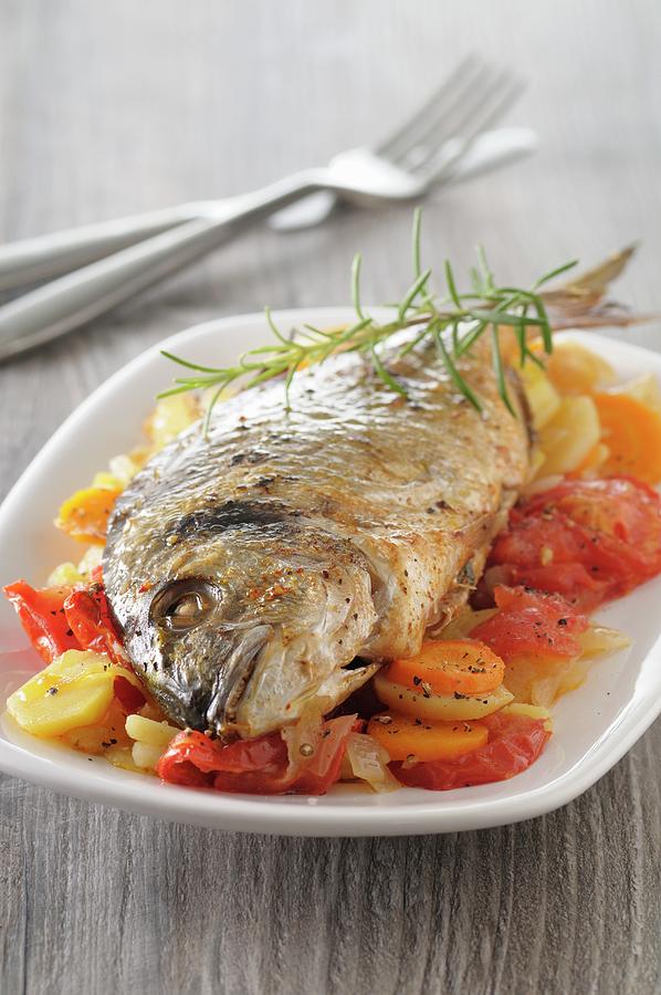 Fried Sea Bream On A Bed Of Vegetables Photograph by Jean-christophe Riou