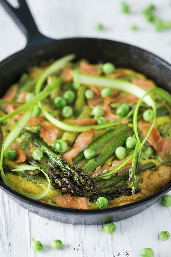 Frittata With Asparagus, Smoked Salmon And Peas In A Rustic Pan Photograph by Malgorzata Laniak