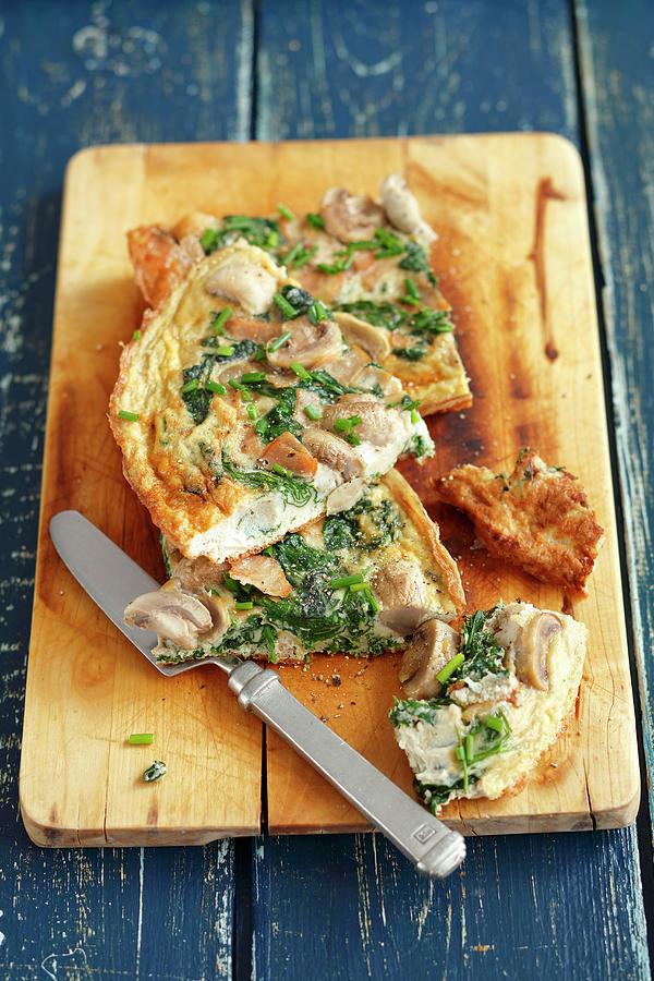 Frittata With Mushrooms, Spinach And Ham On A Chopping Board Photograph by Rua Castilho