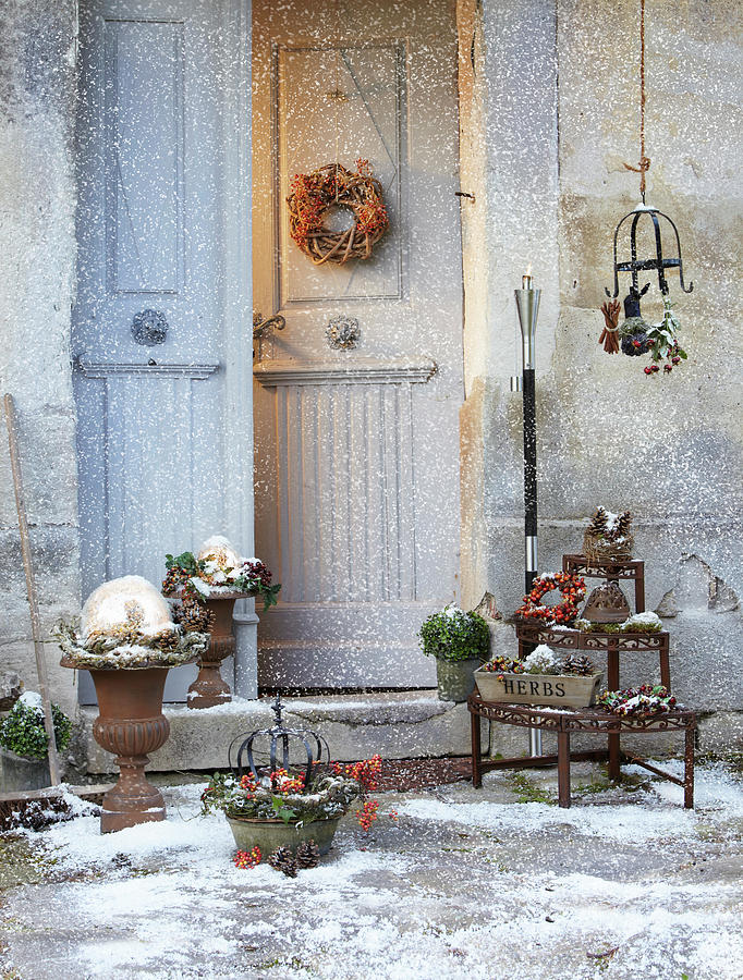 Front Door Surrounded By Wintry Decorations Dusted With Snow Photograph by Werner Krauss