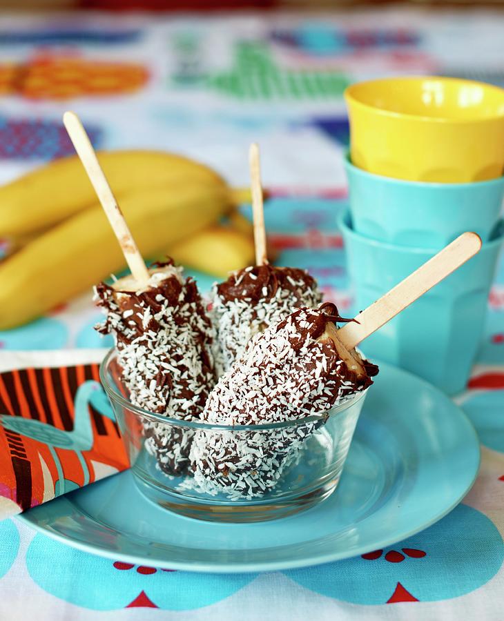 Frozen Bananas With A Chocolate And Coconut Glaze Photograph by Lina Eriksson