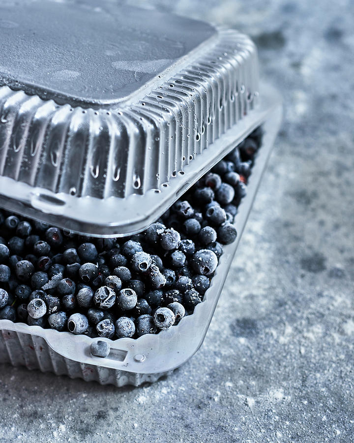 Frozen Blueberries In A Plastic Container Photograph by Miha Lorencak