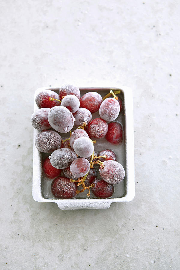 Frozen Grapes In A Metal Dish On A Concrete Surface Photograph by Werner / S. Brigitte