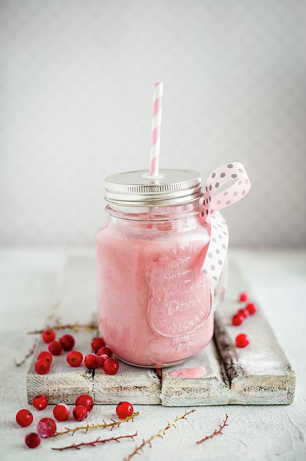 Frozen Yoghurt Drink With Redcurrants Served In A Glass Jar With Screw-on Lid Photograph by Magdalena Hendey