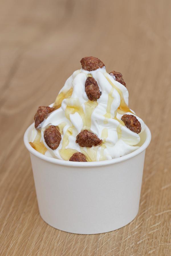 Frozen Yoghurt With Honey And Roasted Almonds Photograph by Esther Hildebrandt