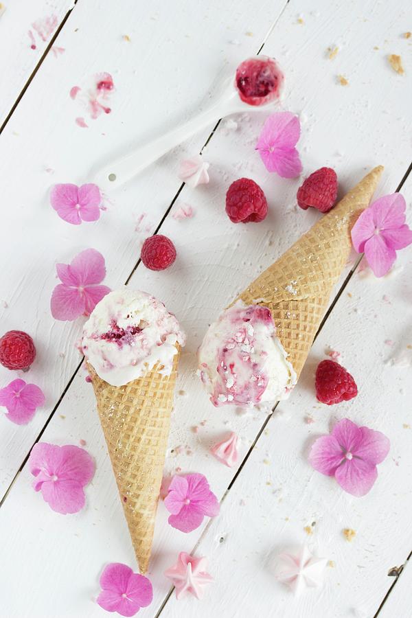 Frozen Yoghurt With Raspberries And Meringue Flowers Photograph by Emma Friedrichs