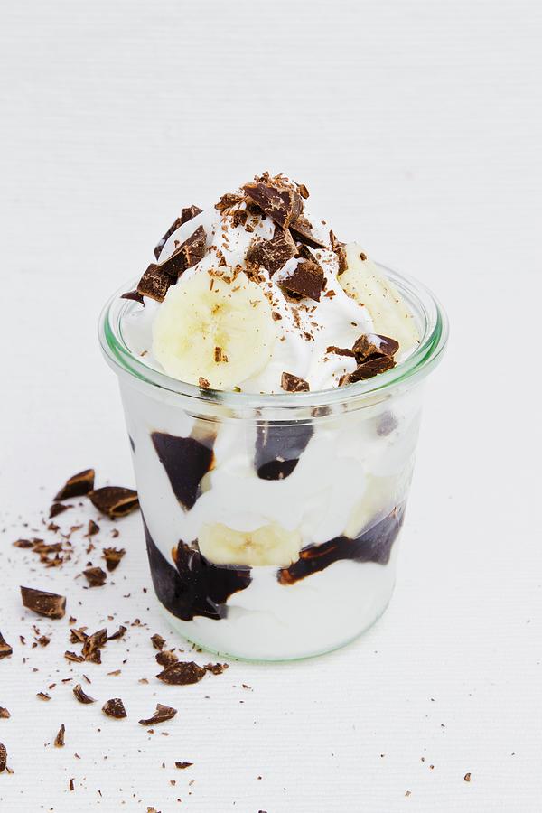 Frozen Yogurt With Banana, Chocolate Sauce And Grated Chocolate Photograph by Esther Hildebrandt