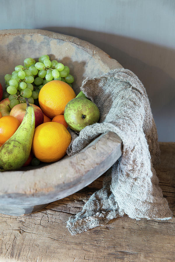 Fruit And Cheesecloth In Rustic Terracotta Bowl Photograph by Jansje Klazinga