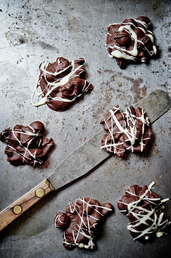 Fruit And Nut Clusters With Chocolate Glaze Photograph by Greg Rannells