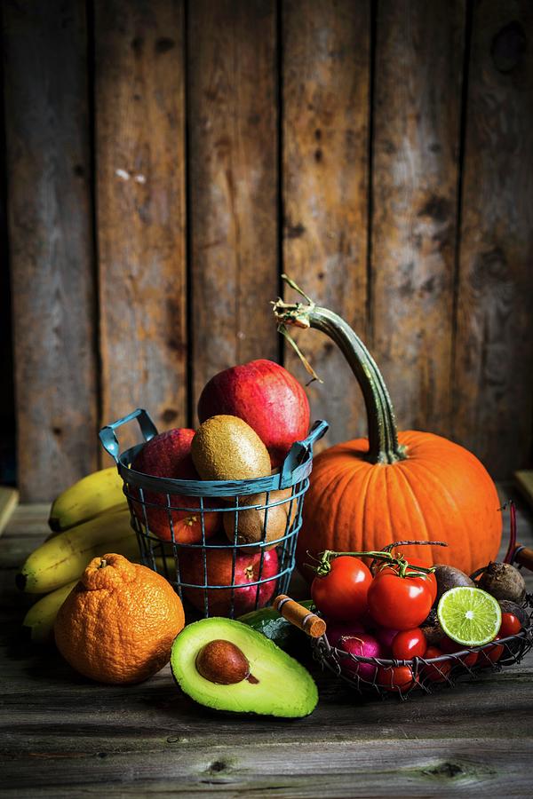Fruit And Vegetables On A Wooden Surface Photograph by Alena Haurylik
