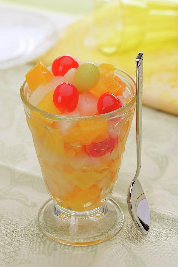 Fruit Cocktail In A Sundae Glass With Syrup-preserved Fruit Photograph by Caste, Alain