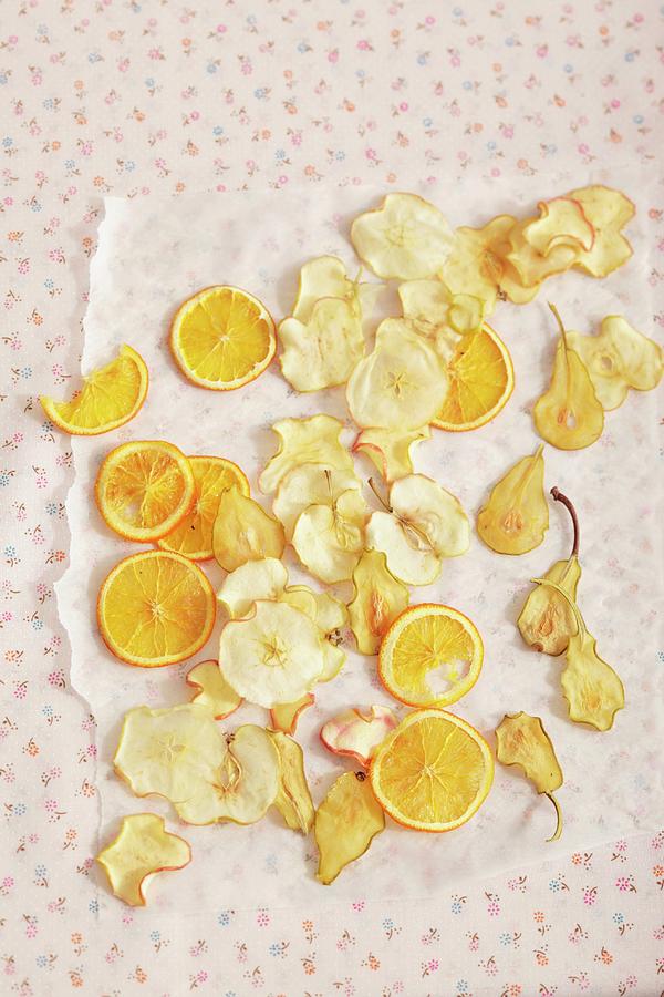 Fruit Crisps Laid Out To Dry On Grease-proof Paper Photograph by Peter Garten