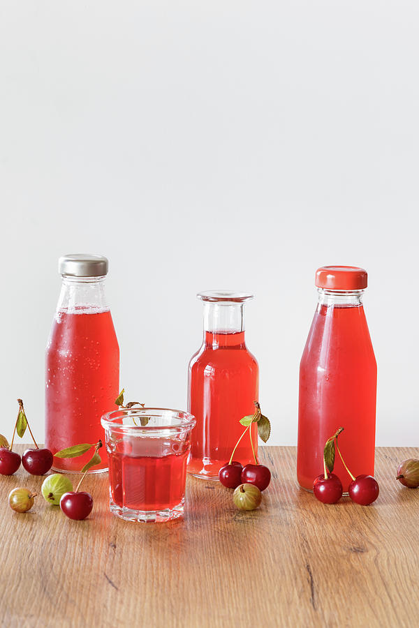 Fruit Drink Made With Stewed Cherries And Gooseberries Photograph by Alla Machutt