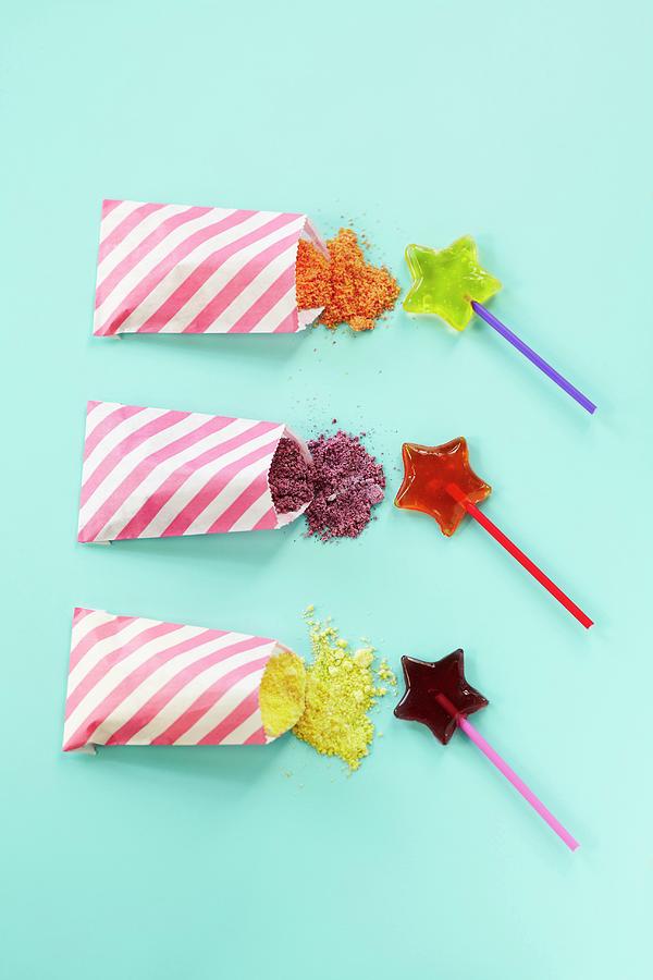 Fruit-flavoured, Star-shaped Lollies With Bags Of Rock Candy For Dipping Photograph by Charlotte Tolhurst