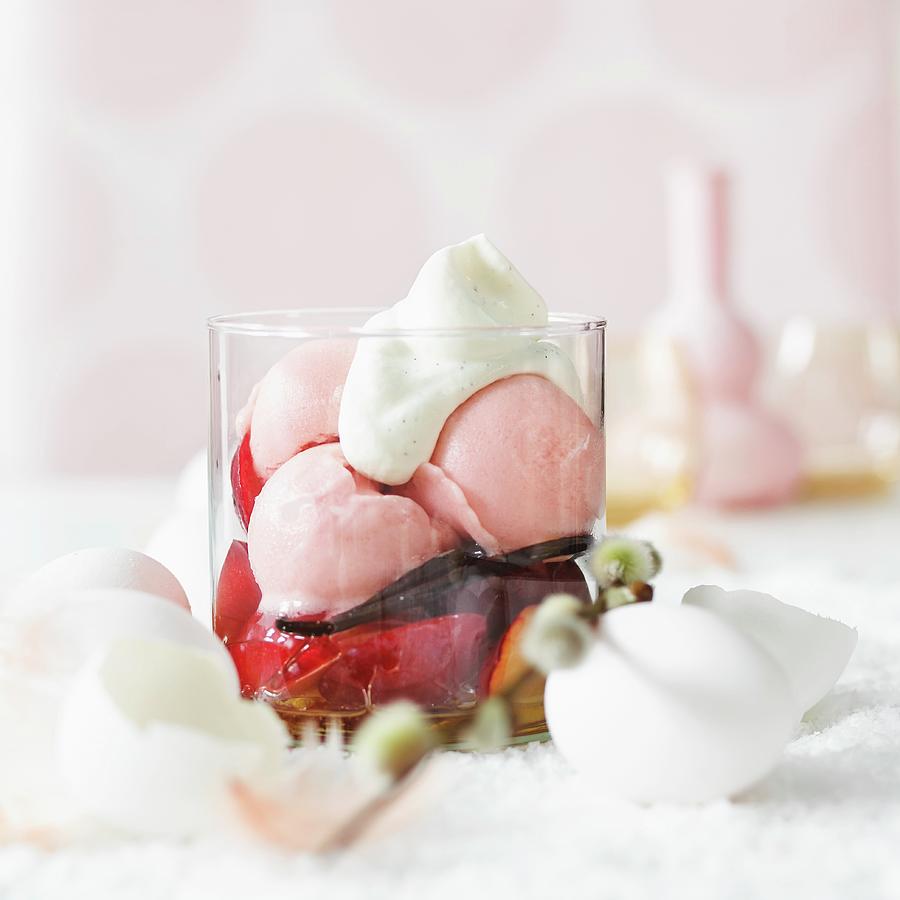 Fruit Ice Cream On Marinated Plums With Vanilla Pods And Cream For Easter Photograph by Hole, Aina C.