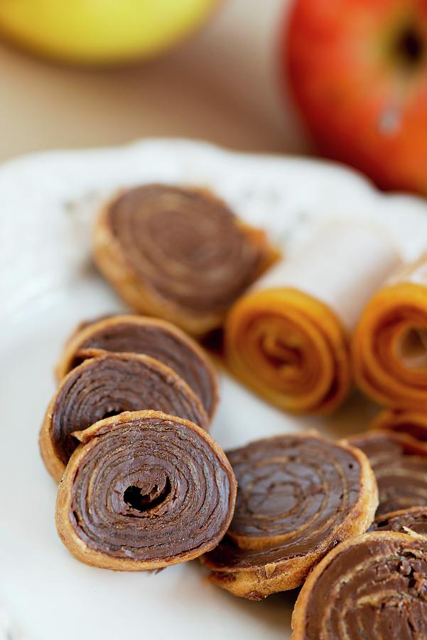 Fruit Leather Rolls Filled With Chocolate Photograph by Rejmer, Ewa
