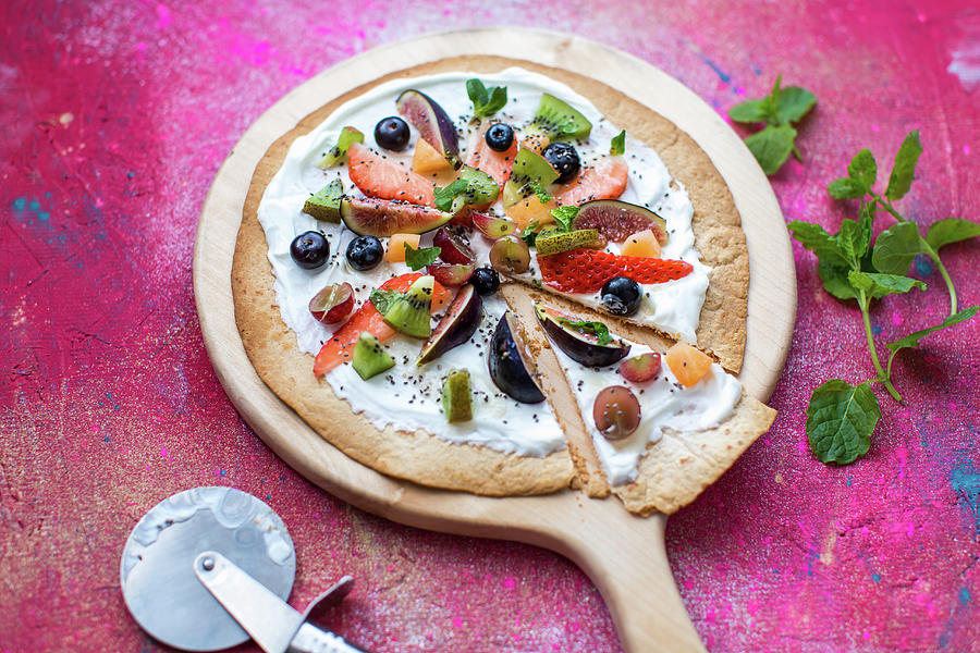 Fruit Pizza Made From A Toasted Tortilla Wrap Base, With Natural Yogurt, Fresh Fruit Toppings, Chia Seeds And Mint To Garnish Photograph by Lara Jane Thorpe