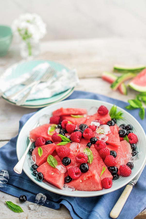 Fruit Plate With Watermelon Slices, Raspberries And Blueberries With Mint And Ice Cubes Photograph by Magdalena Hendey